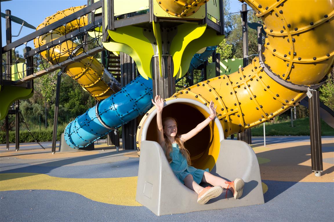 girl-at-the-large-beautiful-playground-in-the-par-2023-11-27-05-00-35-utc