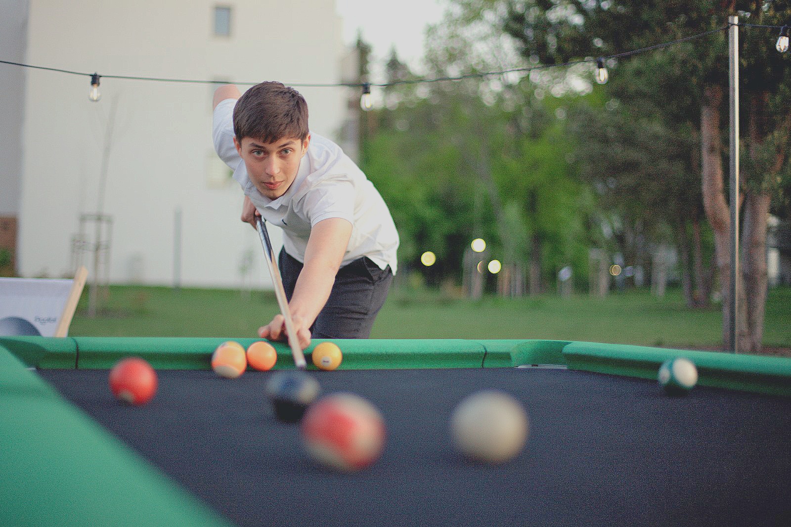 young-man-paying-pool-outside-outdoor
